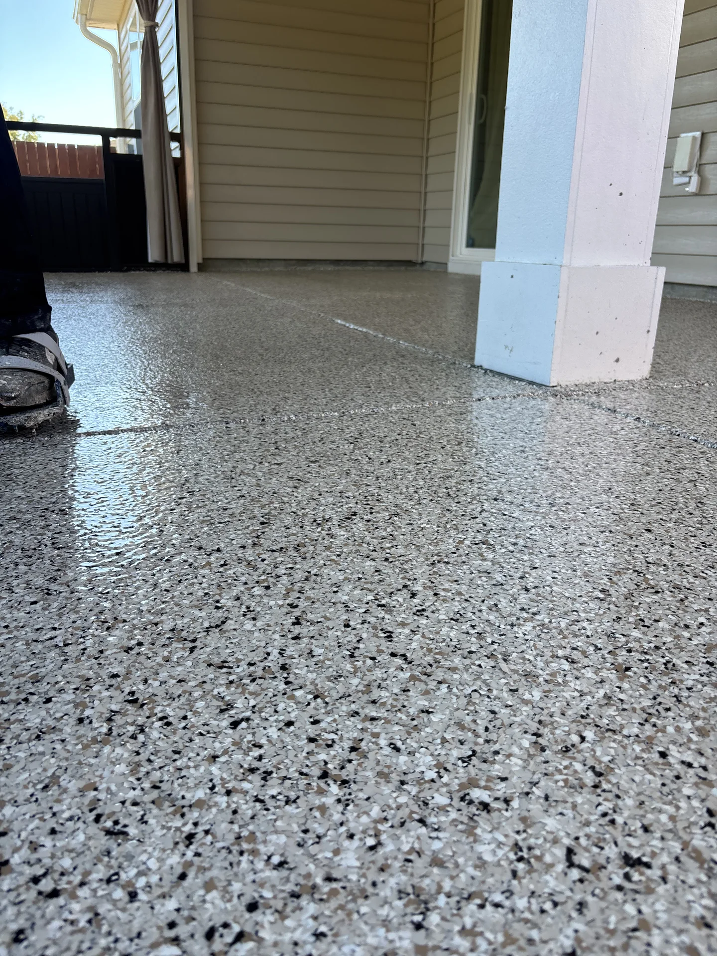 Gray flake-coated residential concrete beside building columns