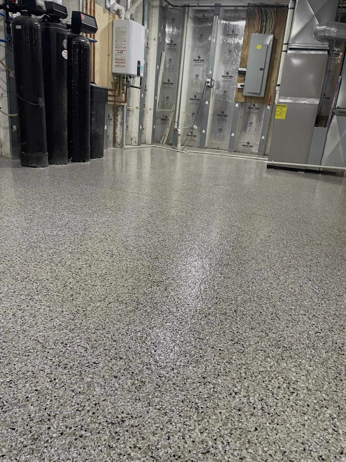 Reflective gray flake epoxy floor in a residential project