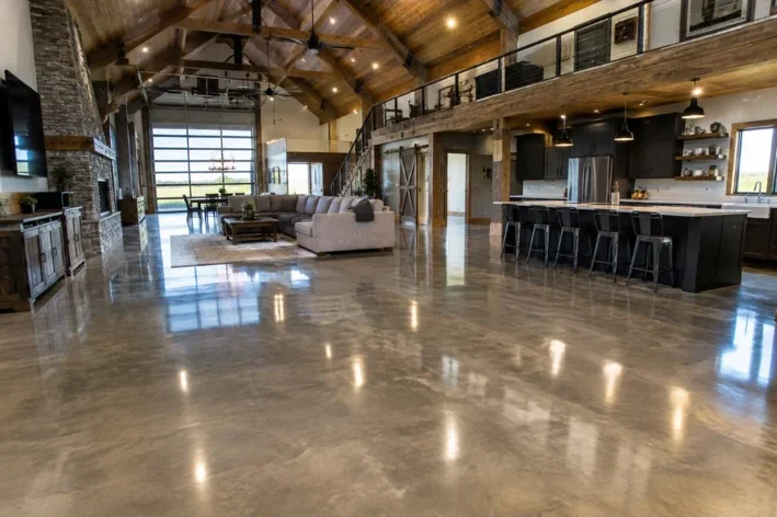 Reflective polished concrete floor in an open-plan timber-framed home