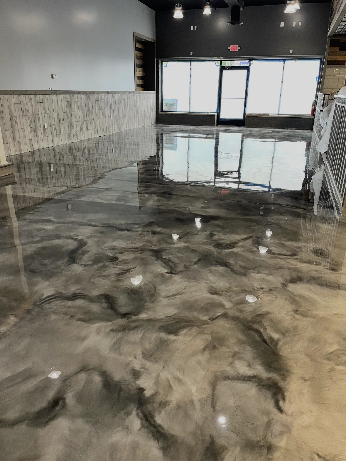 Flowing gray metallic finish across an open interior