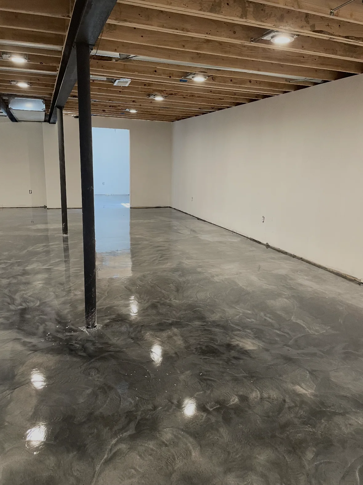 Gray metallic floor around basement columns