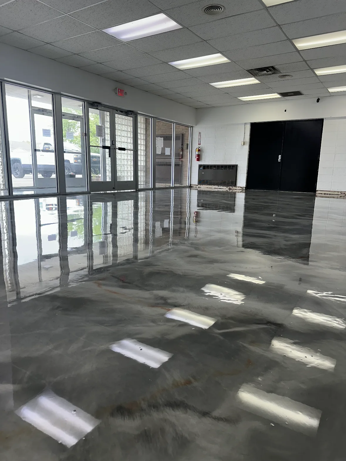 Reflective gray metallic floor in a commercial storefront
