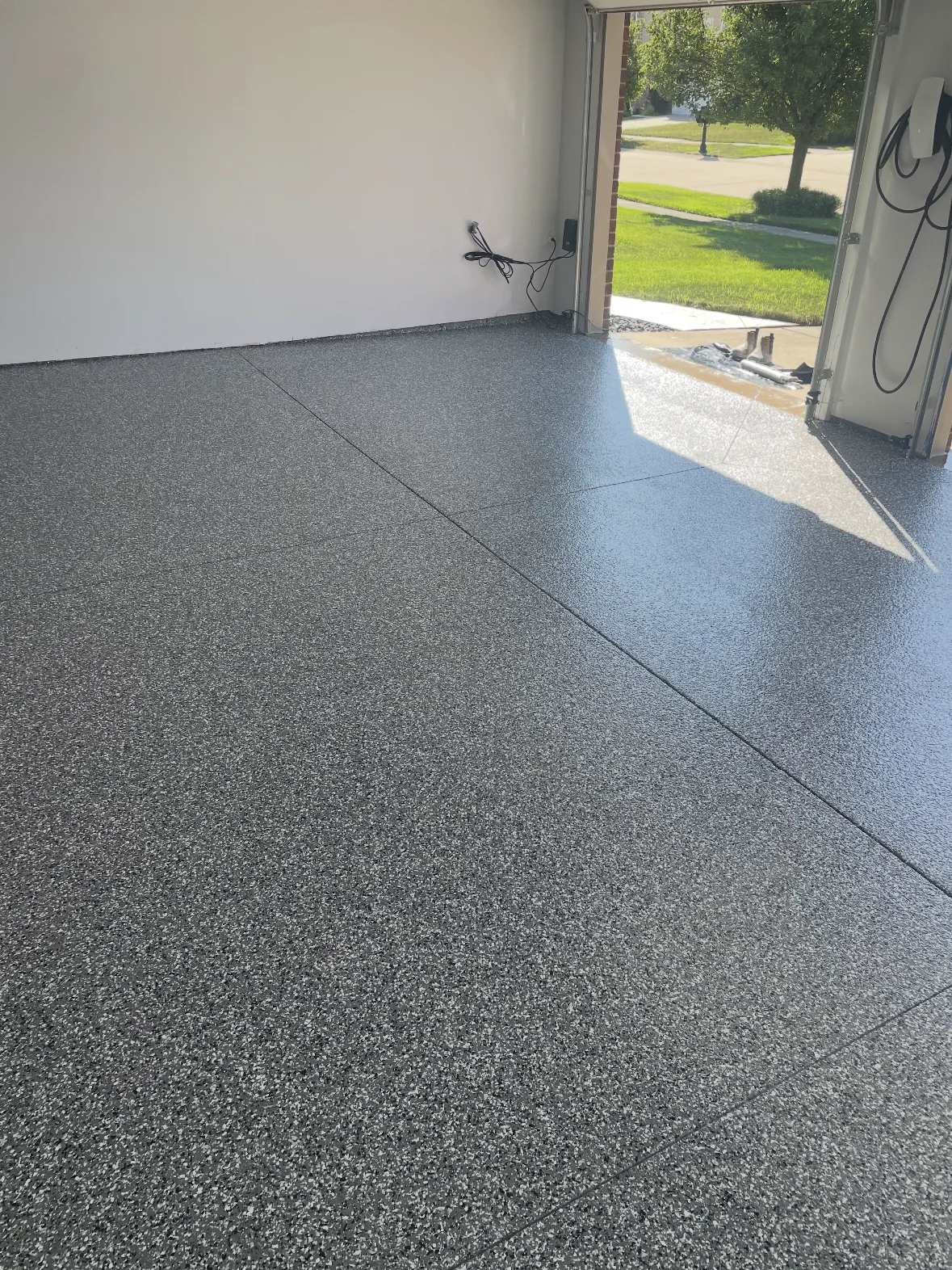 Decorative flake coating across a residential garage floor