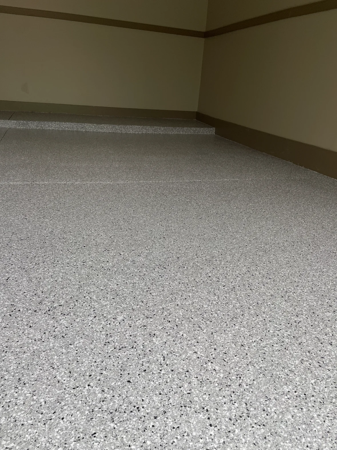 Finished gray flake coating in a residential garage