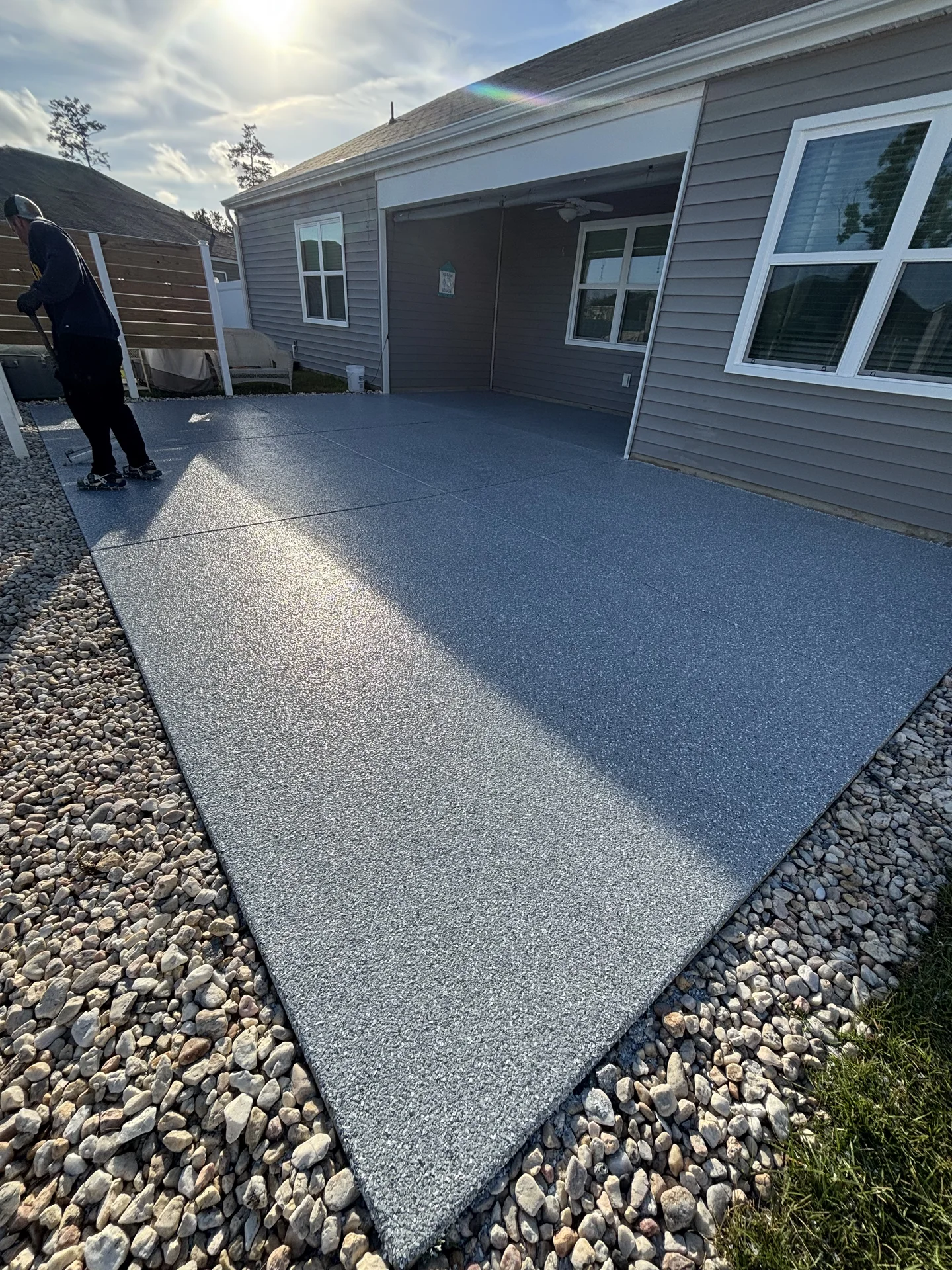 Finished screened porch floor with a gray flake coating