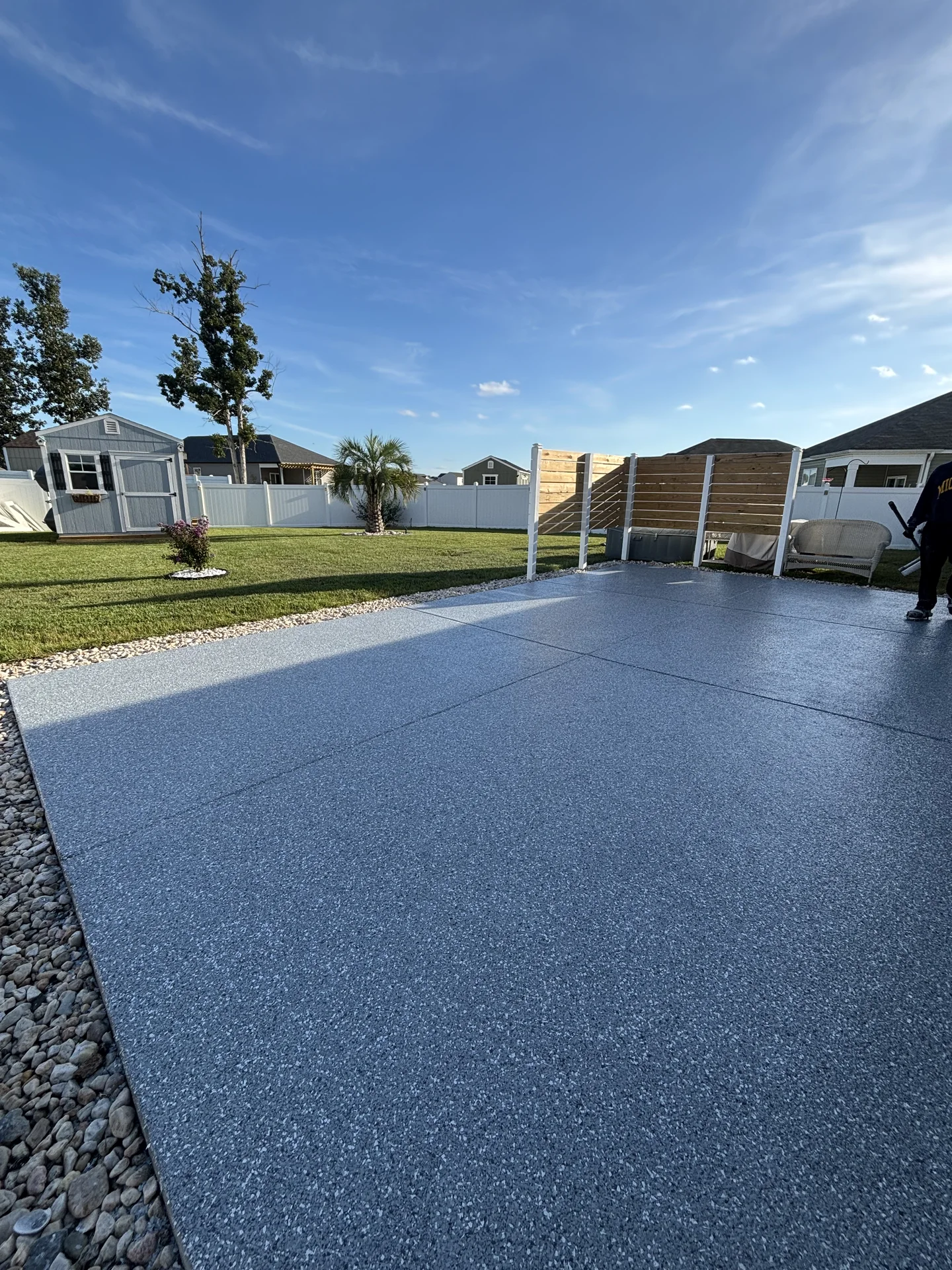 Wide view of a coated residential porch and yard